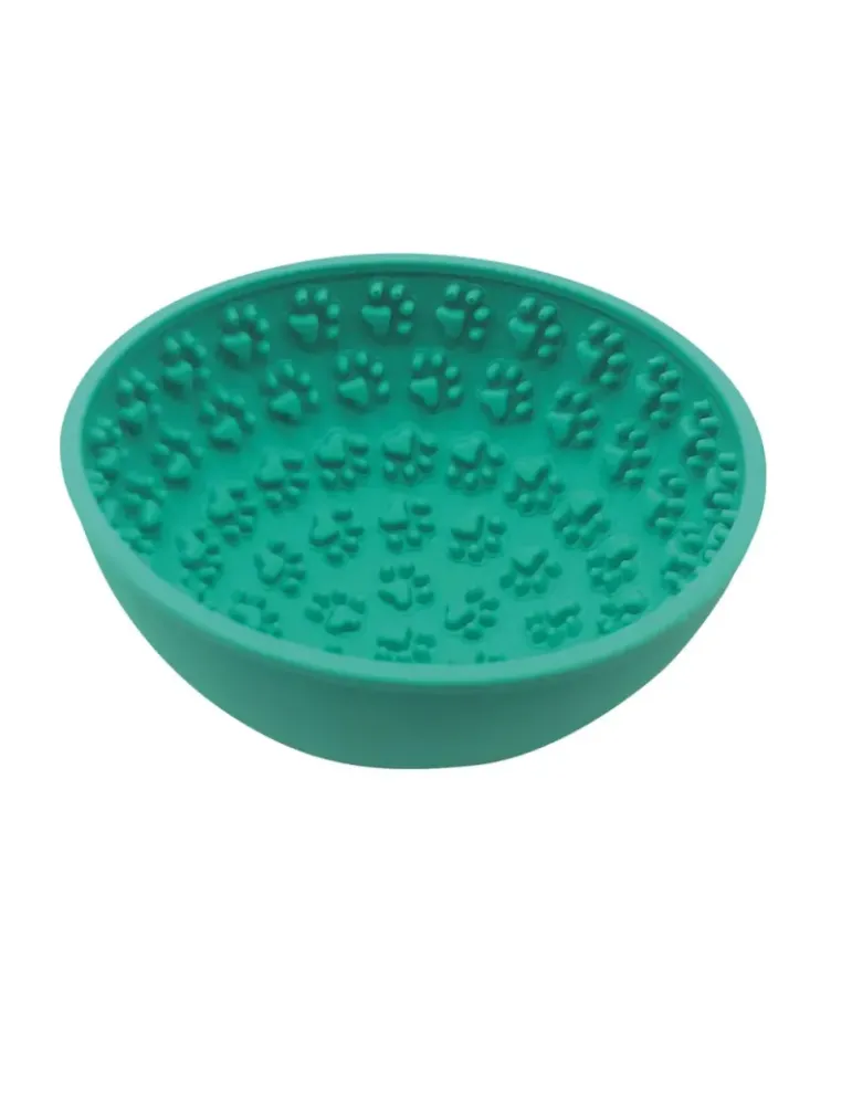 Comedero interactivo verde para perros de silicona con relieve de huellas, ideal para lamer, reducir ansiedad y comer más lento.