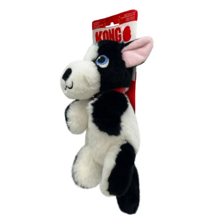 Vista lateral del peluche KONG Comfort Tykes Perro blanco y negro, con etiqueta roja, felpa suave y diseño tierno de perfil.