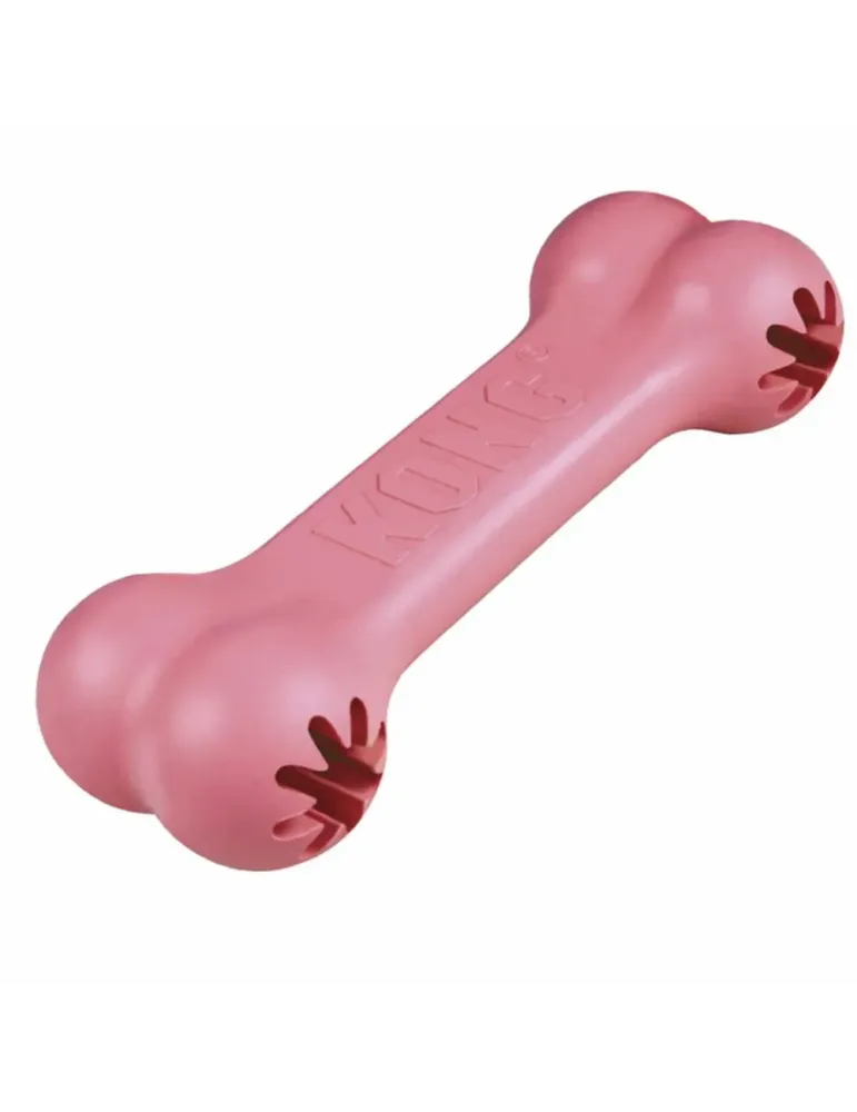 Juguete para cachorro KONG Goodie Bone color rosa, de caucho blando con ranuras para premios.